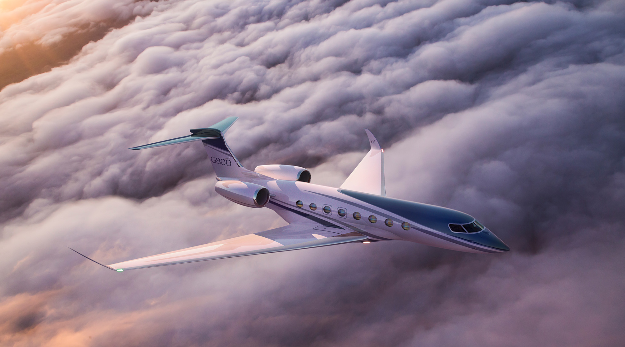 G800 cruises over the cloudtops at sunset